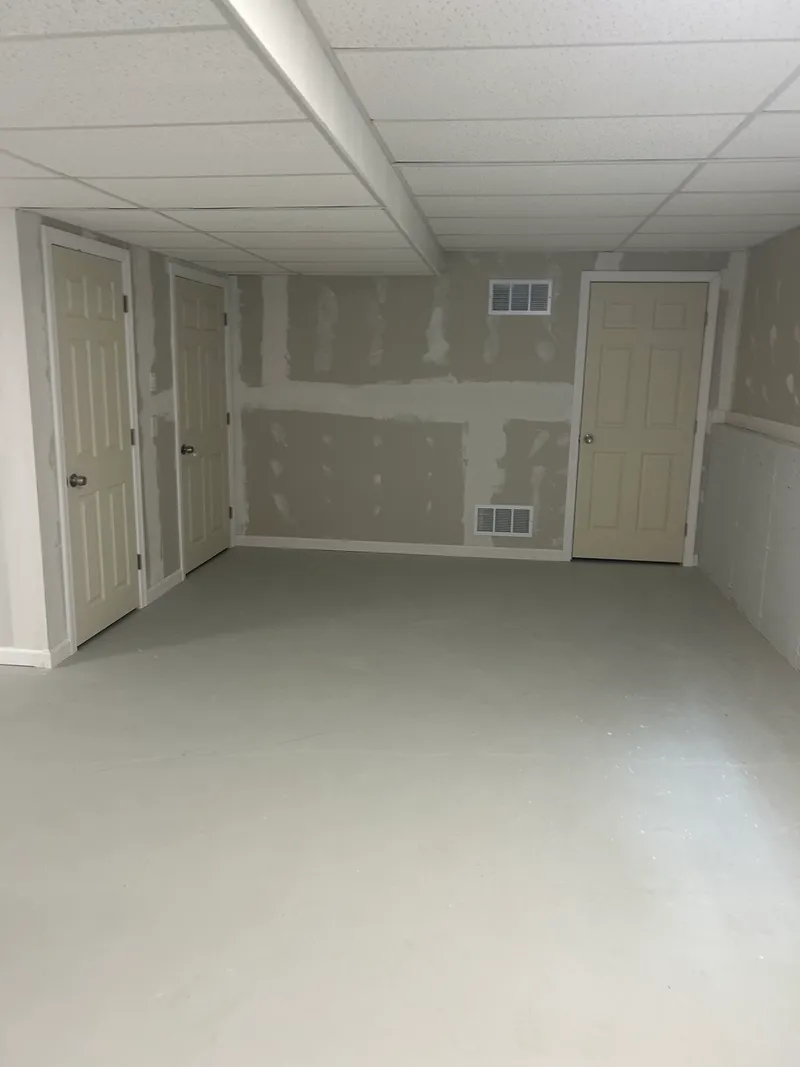 Suspended ceiling grid with acoustic ceiling tiles installed by Mass Framing Solutions