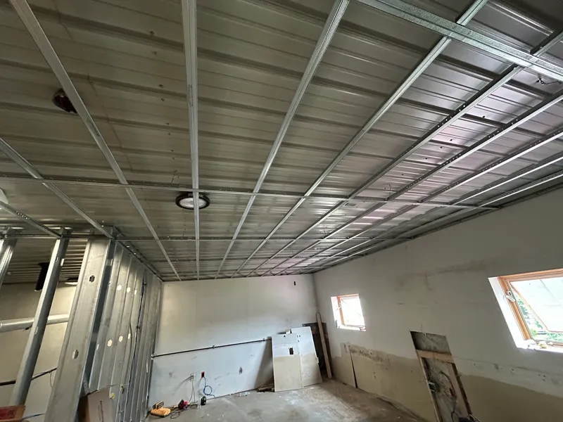 Drywall ceiling grid track installation in Massachusetts by Mass Framing Solutions